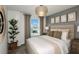 Relaxing bedroom with a plush bed, neutral tones, a window with outdoor views, and stylish decor at 6217 Golden Beach Dr, Apollo Beach, FL 33572