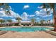 Community pool and clubhouse on a sunny day at 6217 Golden Beach Dr, Apollo Beach, FL 33572