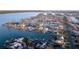 An aerial view shows many waterfront homes lining canals with private docks and ocean access at 720 Capri Blvd, Treasure Island, FL 33706