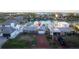 Aerial view of a home in a waterfront neighborhood with direct canal access at 720 Capri Blvd, Treasure Island, FL 33706