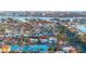 Aerial shot highlighting waterfront homes with docks and ocean access in a coastal neighborhood at 720 Capri Blvd, Treasure Island, FL 33706