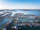An aerial view shows waterfront homes with easy access to the ocean in an established neighborhood at 720 Capri Blvd, Treasure Island, FL 33706