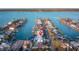 Aerial shot of waterfront homes along canals, each with private docks and pools, marked by a location pin at 720 Capri Blvd, Treasure Island, FL 33706