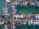 An aerial view displays waterfront homes with private docks and pools in a coastal community at 720 Capri Blvd, Treasure Island, FL 33706