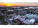 Beautiful waterfront home with stunning sunset views, complemented by a private dock for boating enthusiasts at 720 Capri Blvd, Treasure Island, FL 33706