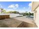 Enjoy outdoor living on the spacious wooden deck overlooking the canal and pool at 720 Capri Blvd, Treasure Island, FL 33706
