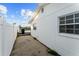 Home's exterior siding with a path to the backyard and dock at 720 Capri Blvd, Treasure Island, FL 33706