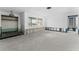 Bright living room under construction featuring a large window, with exposed framing and renovation potential at 720 Capri Blvd, Treasure Island, FL 33706