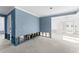 Spacious room under construction with blue accent walls, an open layout, and renovation potential at 720 Capri Blvd, Treasure Island, FL 33706