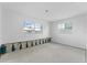 Interior view of an empty room featuring new windows and the unfinished walls at 720 Capri Blvd, Treasure Island, FL 33706
