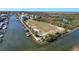 Aerial view of a waterfront property with boat docks at 8437 Indies Dr, Hudson, FL 34667