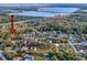 This aerial view shows the property's location near a body of water and a neighborhood setting at 8437 Indies Dr, Hudson, FL 34667