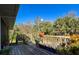 Spacious back deck, great for entertaining with potted plants and wooden railings at 8437 Indies Dr, Hudson, FL 34667