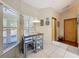 Cozy breakfast nook with a small table and seating area, next to a large window at 8437 Indies Dr, Hudson, FL 34667