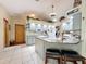 The kitchen offers ample counter space with an island bar and open access to other living areas at 8437 Indies Dr, Hudson, FL 34667