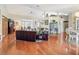 Open living space featuring wood floors, neutral tones, with dining and sitting area at 8437 Indies Dr, Hudson, FL 34667