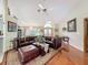 Inviting living room with wood floors and open layout is perfect for entertaining and relaxing at 8437 Indies Dr, Hudson, FL 34667