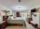 Spacious main bedroom with an accent wall, including carpet and multiple dressers at 8437 Indies Dr, Hudson, FL 34667