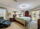 Spacious main bedroom with an accent wall, including carpet and multiple dressers at 8437 Indies Dr, Hudson, FL 34667