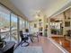 Bright sunroom featuring tile floors and a dining area overlooking the outdoors at 8437 Indies Dr, Hudson, FL 34667