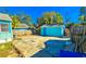 Backyard with shed, fence, and cracked concrete at 860 16Th S Ave, St Petersburg, FL 33701