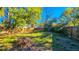 Spacious backyard enclosed by a wood fence, offering privacy and possibilities for landscaping and outdoor living at 860 16Th S Ave, St Petersburg, FL 33701