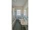 Bathroom with blue tile, white fixtures, and shower curtain at 860 16Th S Ave, St Petersburg, FL 33701