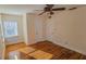 Bedroom with hardwood floors, ceiling fan, and windows at 860 16Th S Ave, St Petersburg, FL 33701