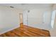 Bedroom with hardwood floors, white trim, two doors, and natural lighting at 860 16Th S Ave, St Petersburg, FL 33701