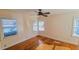 Bedroom with ceiling fan, hardwood floors, and natural light from the windows at 860 16Th S Ave, St Petersburg, FL 33701