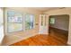 Sunlit dining area with hardwood floors, built-in cabinet and bright windows at 860 16Th S Ave, St Petersburg, FL 33701
