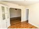 Dining space with hardwood floors, natural light, built-in cabinet and seamless access to the living room at 860 16Th S Ave, St Petersburg, FL 33701