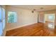 Bright living room featuring hardwood floors, large window with natural light, and an open floor plan at 860 16Th S Ave, St Petersburg, FL 33701