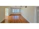 Bright living room featuring hardwood floors, white walls, and multiple windows at 860 16Th S Ave, St Petersburg, FL 33701
