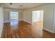 Open-concept living room showcasing hardwood floors, built-in shelving and seamless flow to other spaces at 860 16Th S Ave, St Petersburg, FL 33701