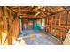An interior view of a framed shed with a wooden beamed roof, showing exposed framing and small windows at 860 16Th S Ave, St Petersburg, FL 33701