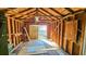 An interior view of a framed shed with a wooden beamed roof, showing the open door out at 860 16Th S Ave, St Petersburg, FL 33701