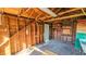 An interior view of a framed shed with a wooden beamed roof, showing exposed framing and a closed door at 860 16Th S Ave, St Petersburg, FL 33701