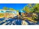 Exterior view of a shed with wood fence and a door open to the side at 860 16Th S Ave, St Petersburg, FL 33701