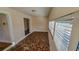 Tiled sunroom features a doorway and an exterior multi-pane window at 860 16Th S Ave, St Petersburg, FL 33701