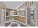 Spacious bathroom with dual sinks, walk-in shower, and access to the walk-in closet at 8746 Tantallon Cir, Tampa, FL 33647