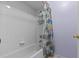 Bathroom featuring a shower/tub and white tiling at 8746 Tantallon Cir, Tampa, FL 33647