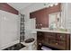 Bathroom featuring a vanity with a dark wood finish and a walk-in shower at 8746 Tantallon Cir, Tampa, FL 33647