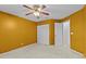 Bedroom with neutral carpet and white closet doors at 8746 Tantallon Cir, Tampa, FL 33647
