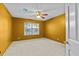 Empty bedroom featuring a ceiling fan and neutral carpet flooring at 8746 Tantallon Cir, Tampa, FL 33647