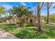 View of the front yard featuring professional landscaping, including various plants and large shade trees at 8746 Tantallon Cir, Tampa, FL 33647