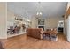 Comfortable living room with hardwood floors, fireplace, and open to the kitchen at 8746 Tantallon Cir, Tampa, FL 33647