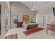 Spacious main bedroom featuring vaulted ceilings, neutral tones, large windows, and comfortable layout at 8746 Tantallon Cir, Tampa, FL 33647