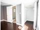 This bedroom features a walk-in closet and a bathroom with a glass door shower at 8909 N Dexter Ave, Tampa, FL 33604