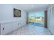 Dining area with built-in cabinet, sliding door, and tile floor at 9214 Mission Oaks Blvd, Seminole, FL 33776
